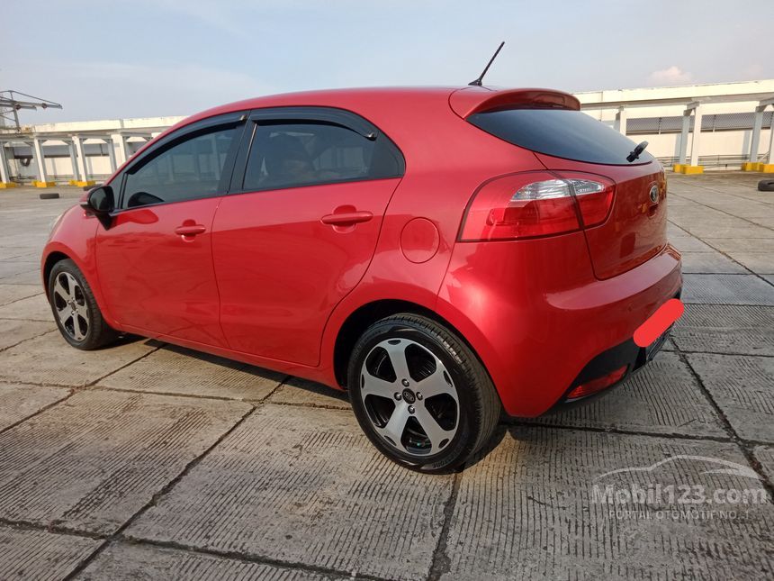 Jual Mobil KIA Rio 2013 UB 1 4 Di DKI Jakarta Automatic Hatchback Merah