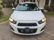 Jual Mobil Chevrolet Aveo 2014 LT 1.4 di Jawa Timur Automatic Sedan Putih Rp 100.000.000