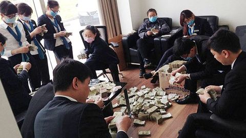 Woman In China Pays For A New BMW With 100KG Of Small Change